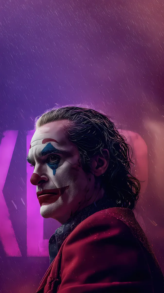 The Joker from the movie, Joaquin Phoenix, in his clown makeup and red suit jacket, standing in the rain with purple neon lights in the background.
